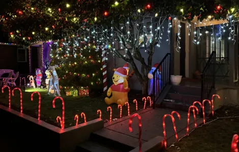 house with lots of christmas decorations and lights on Candy Cany Lane in Seattle