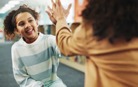girl giving woman a high five
