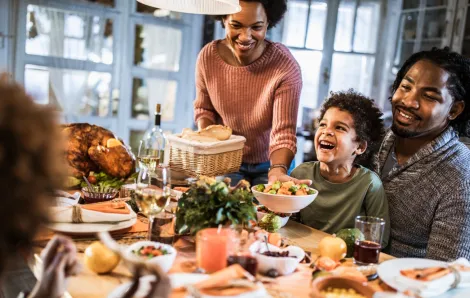 happy family at Thanksgiving table