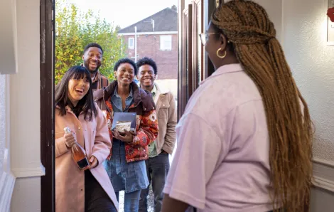 group of friends arriving at a holiday party
