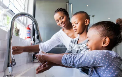 Family washing their hands together