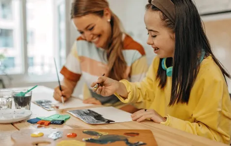 young girl painting during a sensory-friendly outing in Seattle