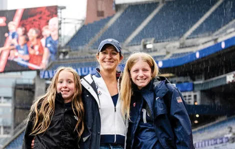 stephanie cox with her daughters in the field