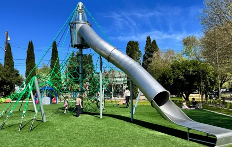 kids playing on the climbing structure at South Park's new playground in Seattle