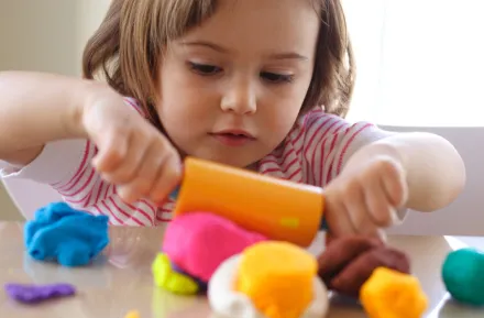 Girl playing with play-dough