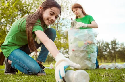 teen girl volunteering at a park clean-up in Seattle 