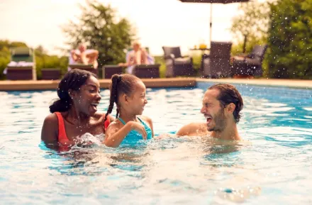 a family in a pool using a seattle hotel pass as a way to access this amenity