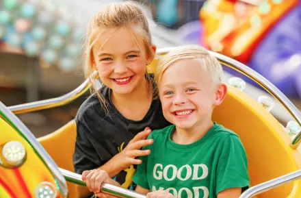 Two kids on a ride at the Washington State Spring Fair