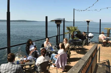 Families enjoying a meal at Duke's, a waterfront restaurant in Tacoma