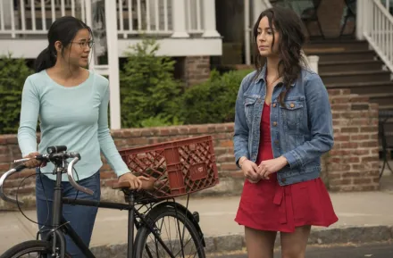 two girls walking on the sidewalk, a still image from the movie "The Half of It"
