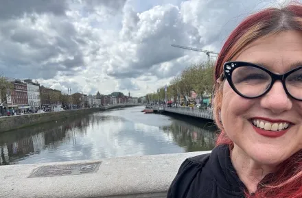 Dana DuBois standing near the Liffey River in Ireland