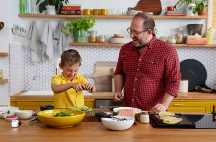 Joel Gamoran and his son having fun in the kitchen 