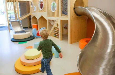 young child playing inside the play area at Nixi City, an  indoor play cafe in Shoreline