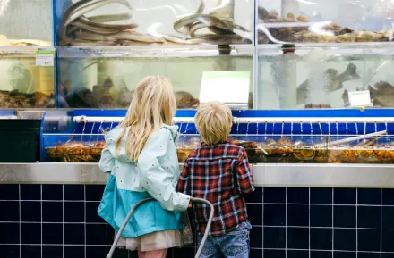 two kids looking at the fresh food for sale at T&T supermarket in Lynnwood