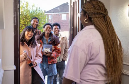 group of friends arriving at a holiday party