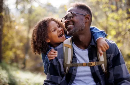 A boy and a dad hiking on a sunny day helps them connect and bond