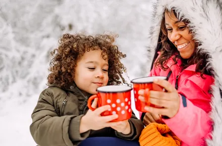 mom and son drinking hot chocolate together