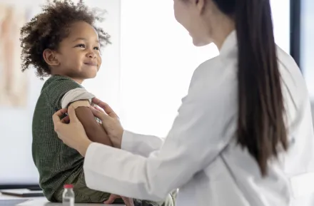 child receiving a measles vaccine