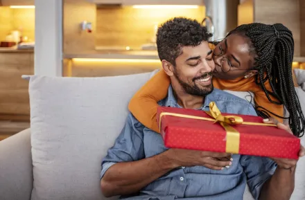 couple giving Valentine's Day gift smiling and happy