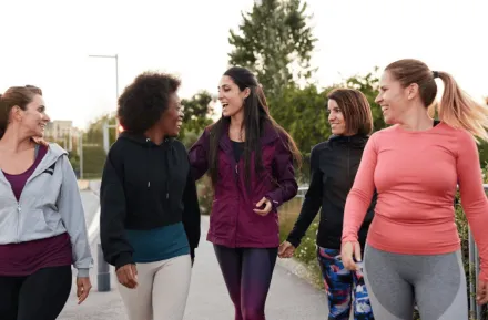 A group of women walking and talking