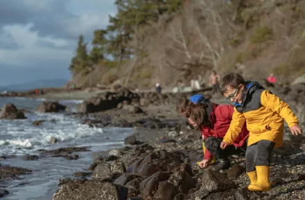 exploring a Pacific Northwest beach on a cloudy, gray day to embrace bad weather with kids