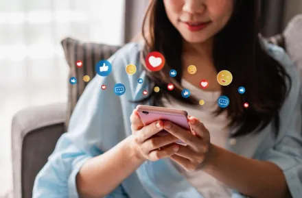 young girl using social media on smartphone