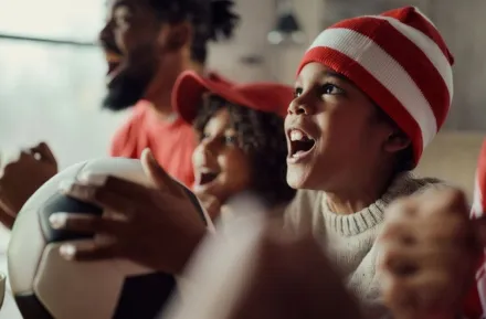 family watching soccer game