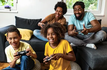 family playing video games together