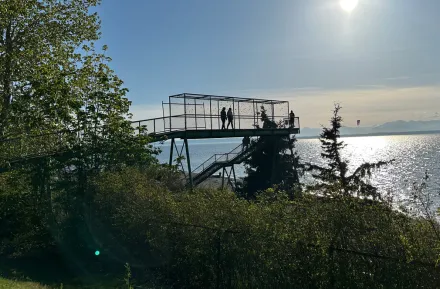 scenic view of the water with a footbridge to it at Carkeek Park