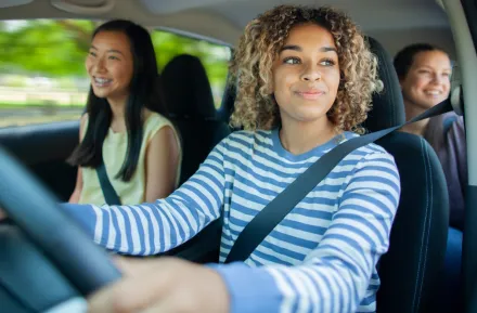 teen girls driving in a car