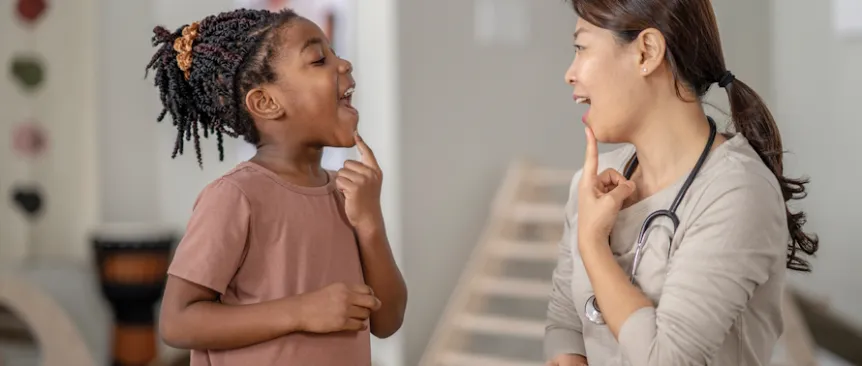 Young girl having speech therapy