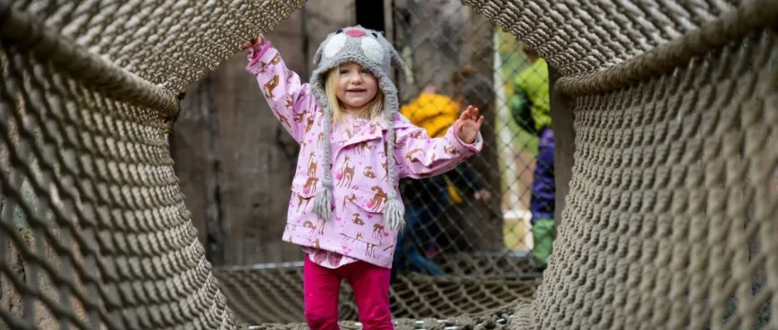 little girl playing in the nets