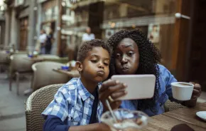 Mom-and-son-at-cafe-taking-selfie-parent-kid-date-night-ideas