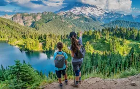 Mother and son hike in Mount Rainier National Park, Washington state, USA new reservation system