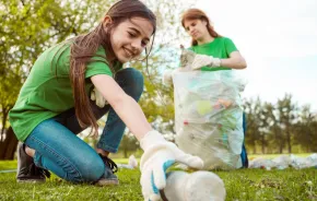 teen girl volunteering at a park clean-up in Seattle 