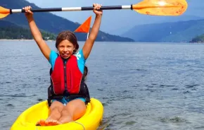 girl kayaking on a lake is a fun thing to do this weekend in Seattle