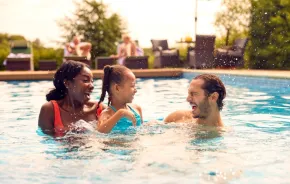 a family in a pool using a seattle hotel pass as a way to access this amenity
