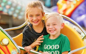 Two kids on a ride at the Washington State Spring Fair