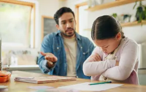 a dad tries to reason with his upset daughter, one gentle parenting tactic