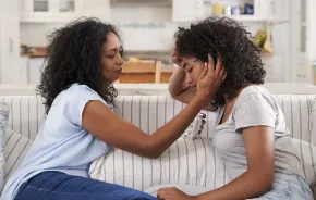 Mom helping daughter with emotional distress