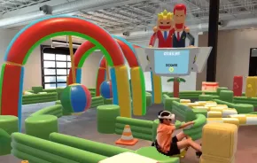 young boy wearing VR headseat at DreamPark Seattle playing an immersive video game