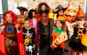 Group of kids in Halloween costumes 