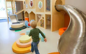 young child playing inside the play area at Nixi City, an  indoor play cafe in Shoreline