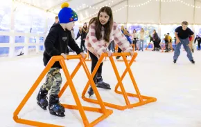kids ice skating together at Tulalip Lights and Ice