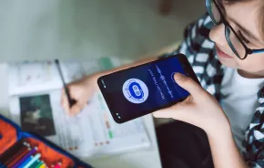 Boy using system AI Chatbot on mobile application