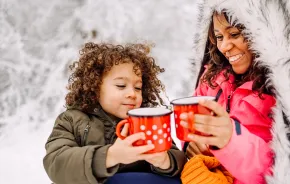 mom and son drinking hot chocolate together