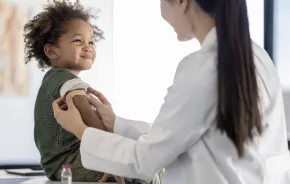 child receiving a measles vaccine