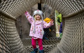 little girl playing in the nets