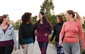 A group of women walking and talking