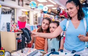 mother and daughters shopping in a store